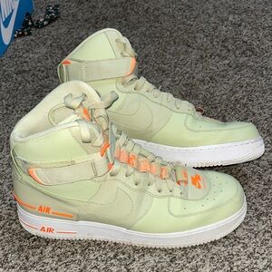 Nike Light Green Sneakers with Subtle Orange Details